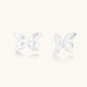 Pair of translucent butterfly-shaped stud earrings with frosted finish and dimensional wing details on white background