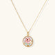 Gold-plated circular pendant with pink enamel rose, pearl background, and delicate beaded border on chain